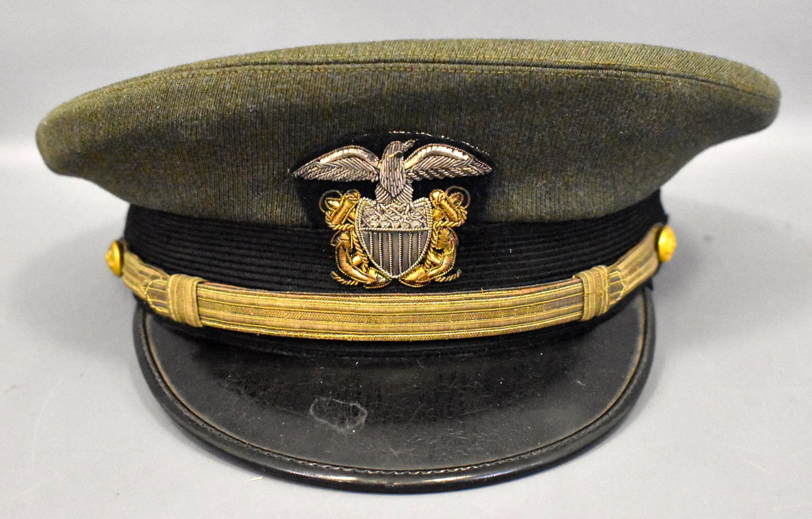 WWII military USN US Navy pilot officers uniform green: WWII military USN US Navy Aviator pilot scarce officers uniform green dress cap hat with wicker head band. Named to Lt. jg Charles Budenz Size 7 1/4 Excellent condition.