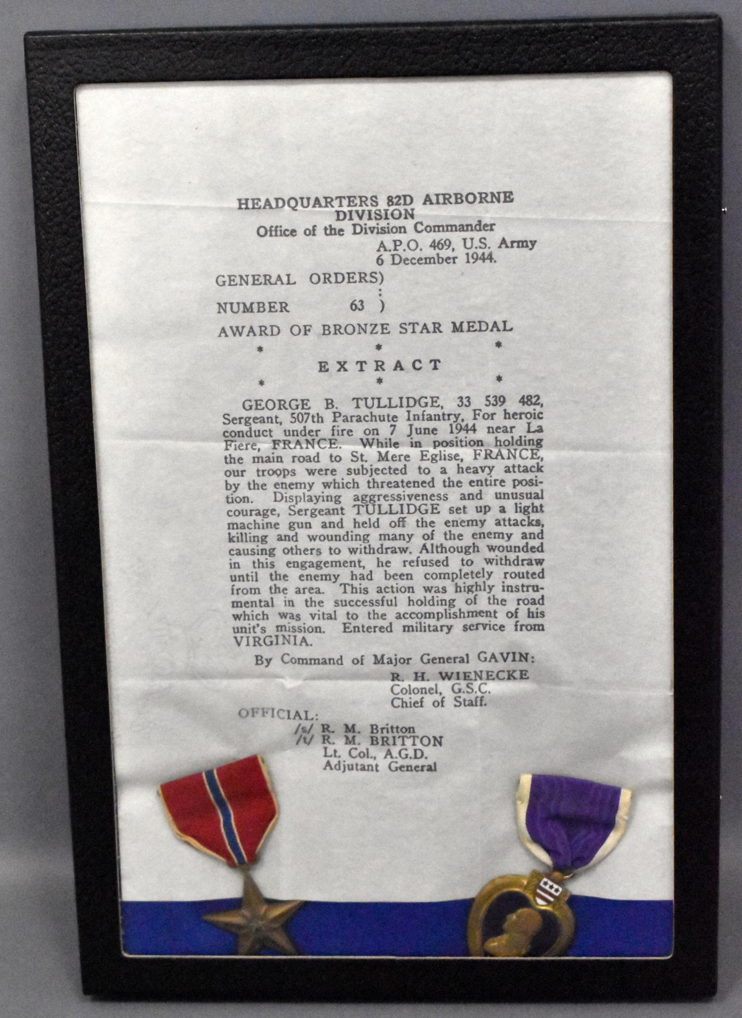 US WWII 82nd Airborne D-Day George Tullidge Bronze Star: US WWII 82nd Airborne D-Day veteran George Tullidge Bronze Star grouping including original tissue paper Bronze Star citation with Bronze Star and Purple Heart in Riker Frame.
