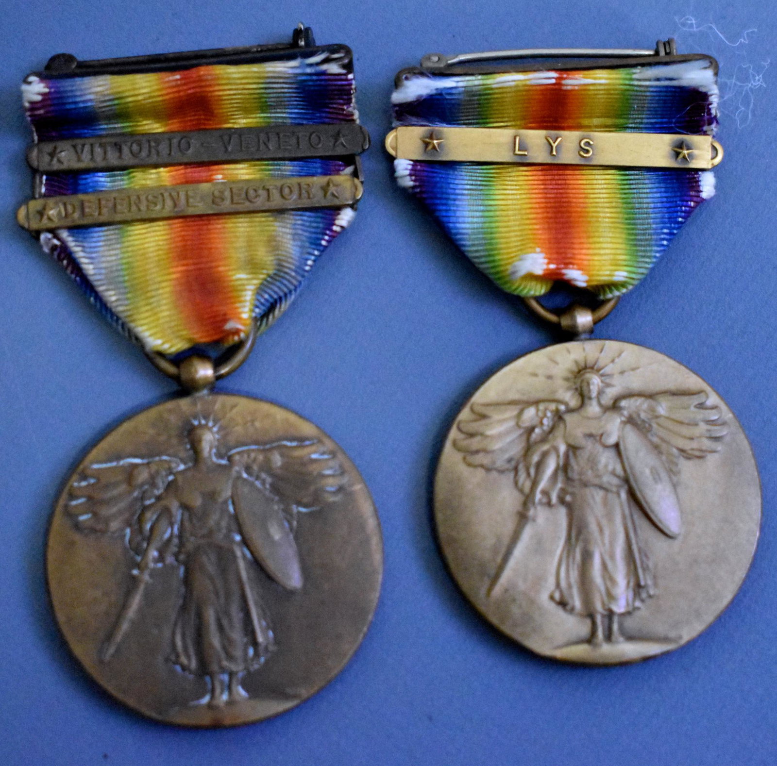 Two WWI US victory medals with Lys & Def Sect &: Two WWI US victory medals one with Lys and other with Def Sect and Vittorio Veneto campaign clasp bars.