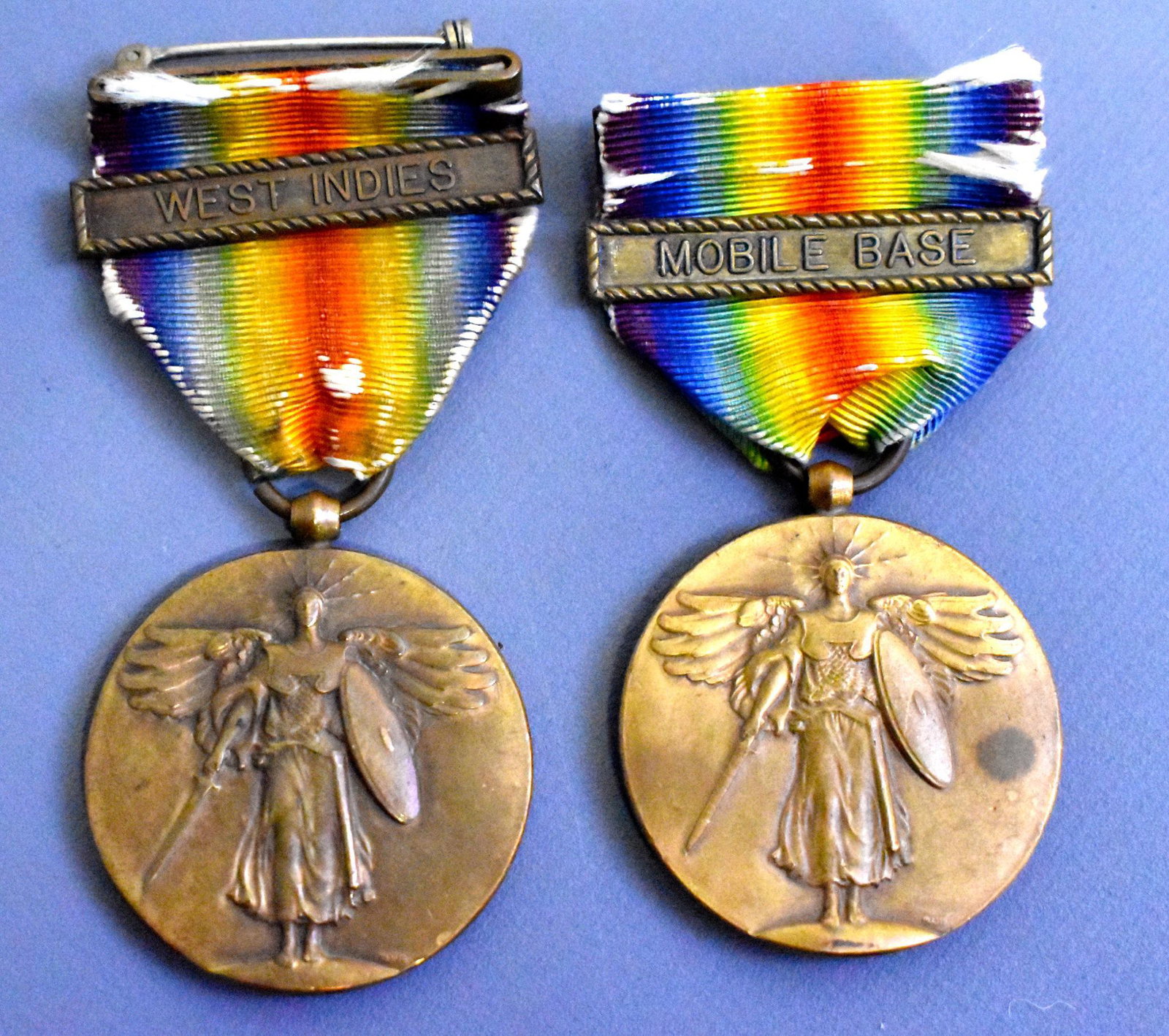 Two WWI US Navy victory medals w/ West Indies & Mobile: Two WWI US Navy USN victory medals one with West Indies and other Mobile Base campaign clasp bars.