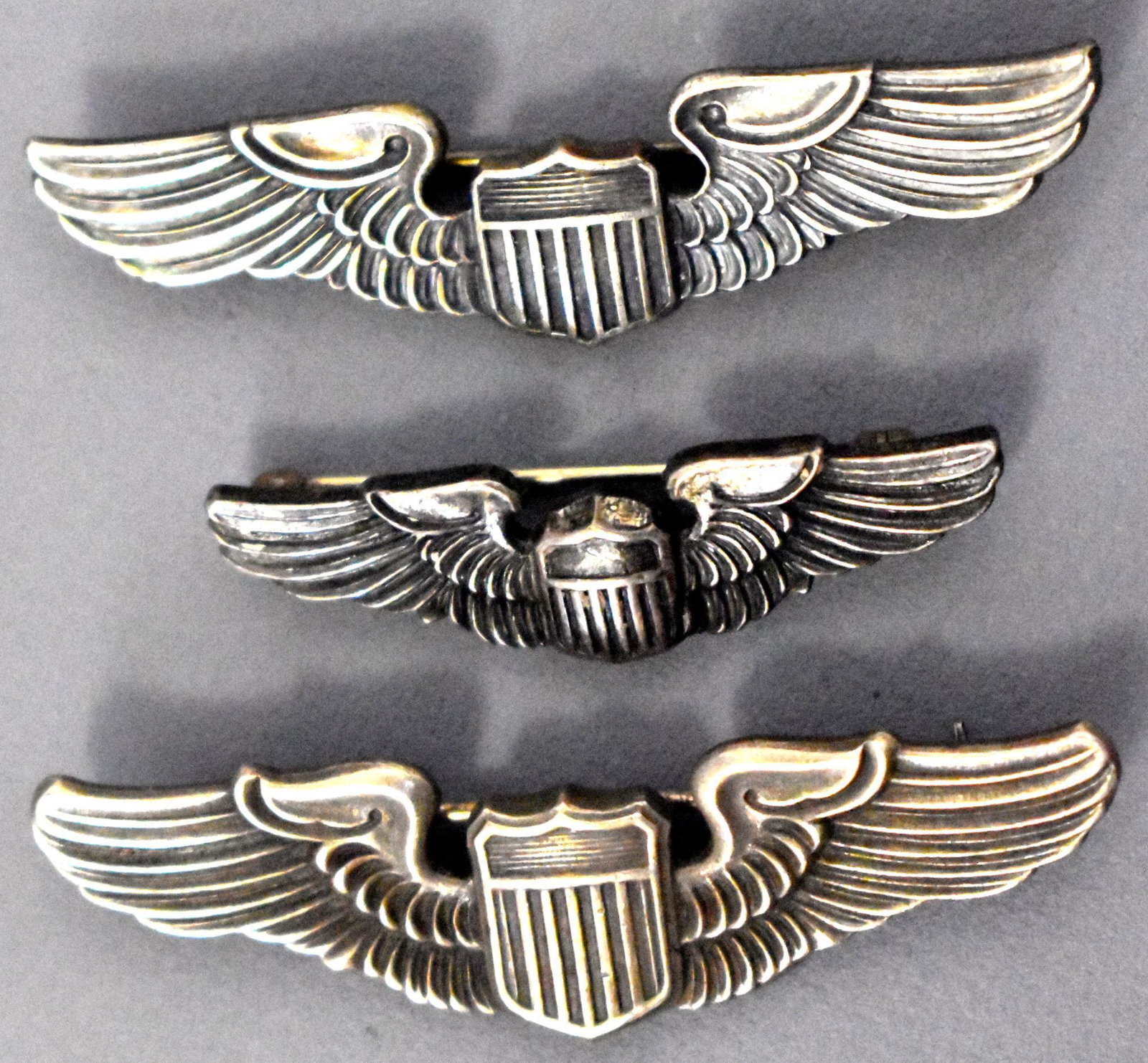 US WWII USAAF Army Air Corp three small pilots wings: US WWII USAAF Army Air Corp three small pilots wings 2 inch marked Balfour, a 2 inch marked Meyers and 1 1/2 inch marked sterling all pin back and excellent condition.