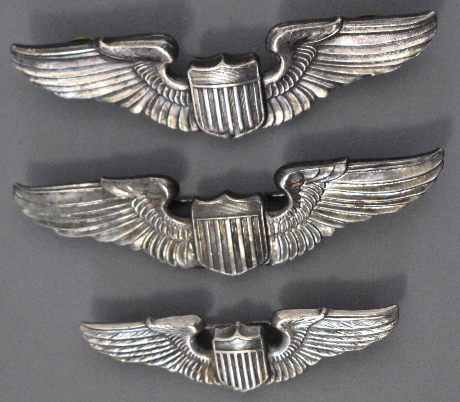 US WWII military USAAF Army Air Corp three pilots wings: US WWII USAAF Army Air Corp three pilots wings 3 inch pin back and clutch back 2 1/4 inch pin back, all marked sterling.