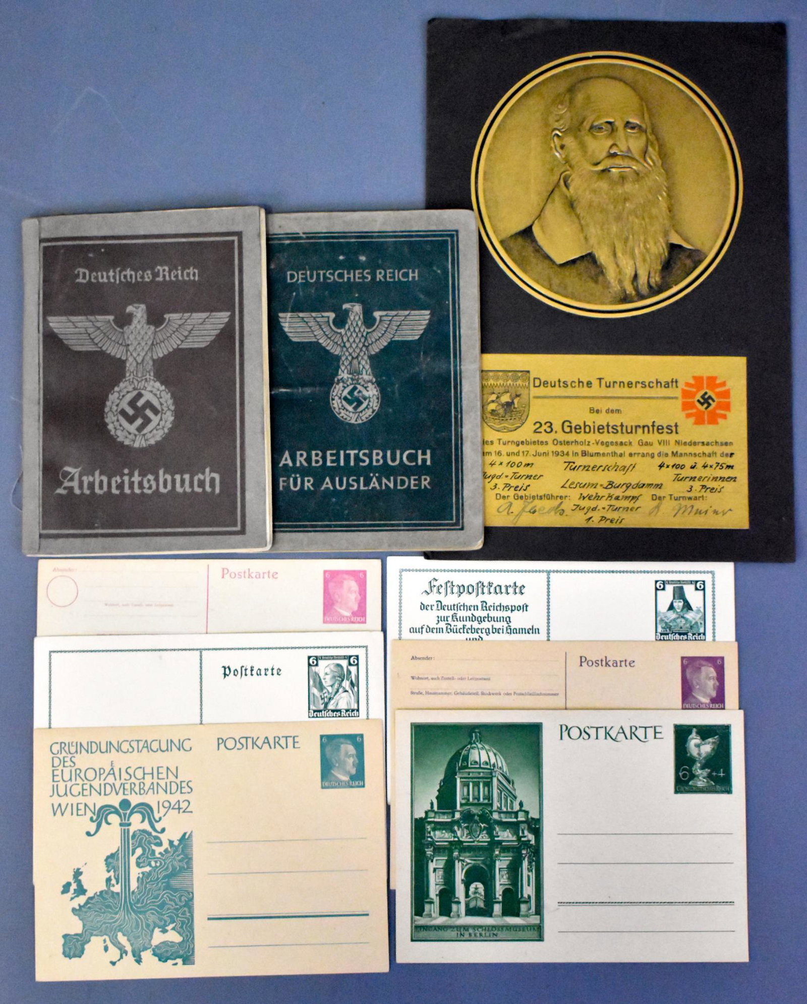 WWII Nazi German 6 postcards 2 pass books and: WWII Nazi German two Arbeitsbuch pass books six post cards and a Turnerschaft certificate see photos.