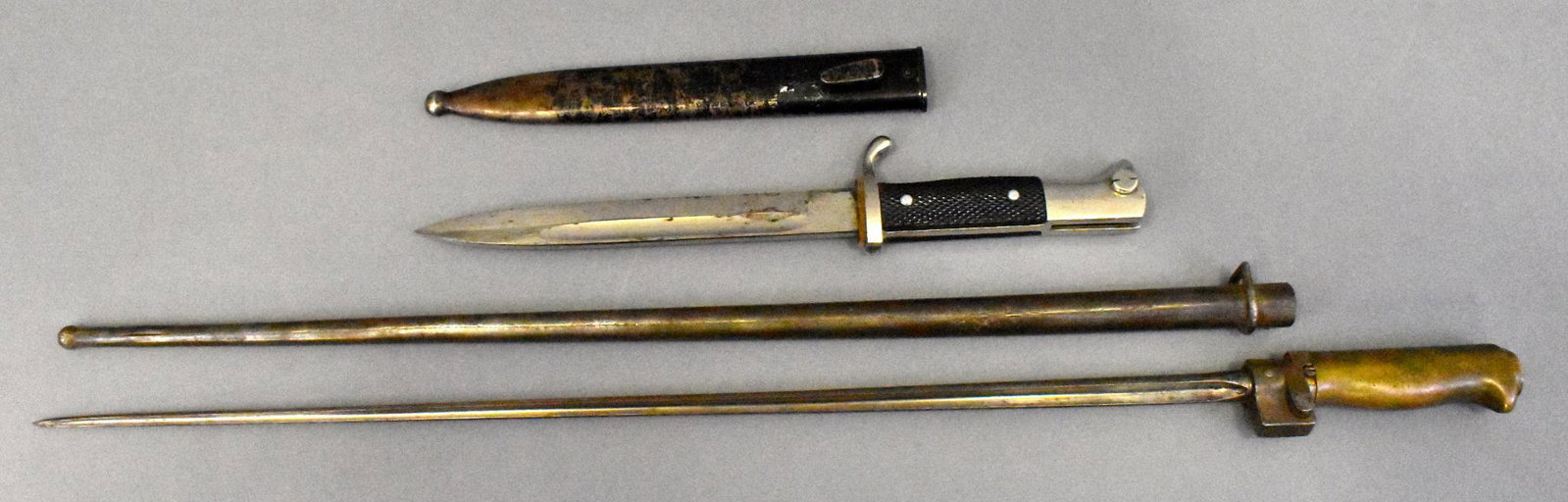 WWII German K98 Mauser dress bayonet & French Lebel: WWII German K98 Mauser dress bayonet not marked paint loss on scabbard & French Lebel bayonet with scabbard mounting ring appears to have been cut off.
