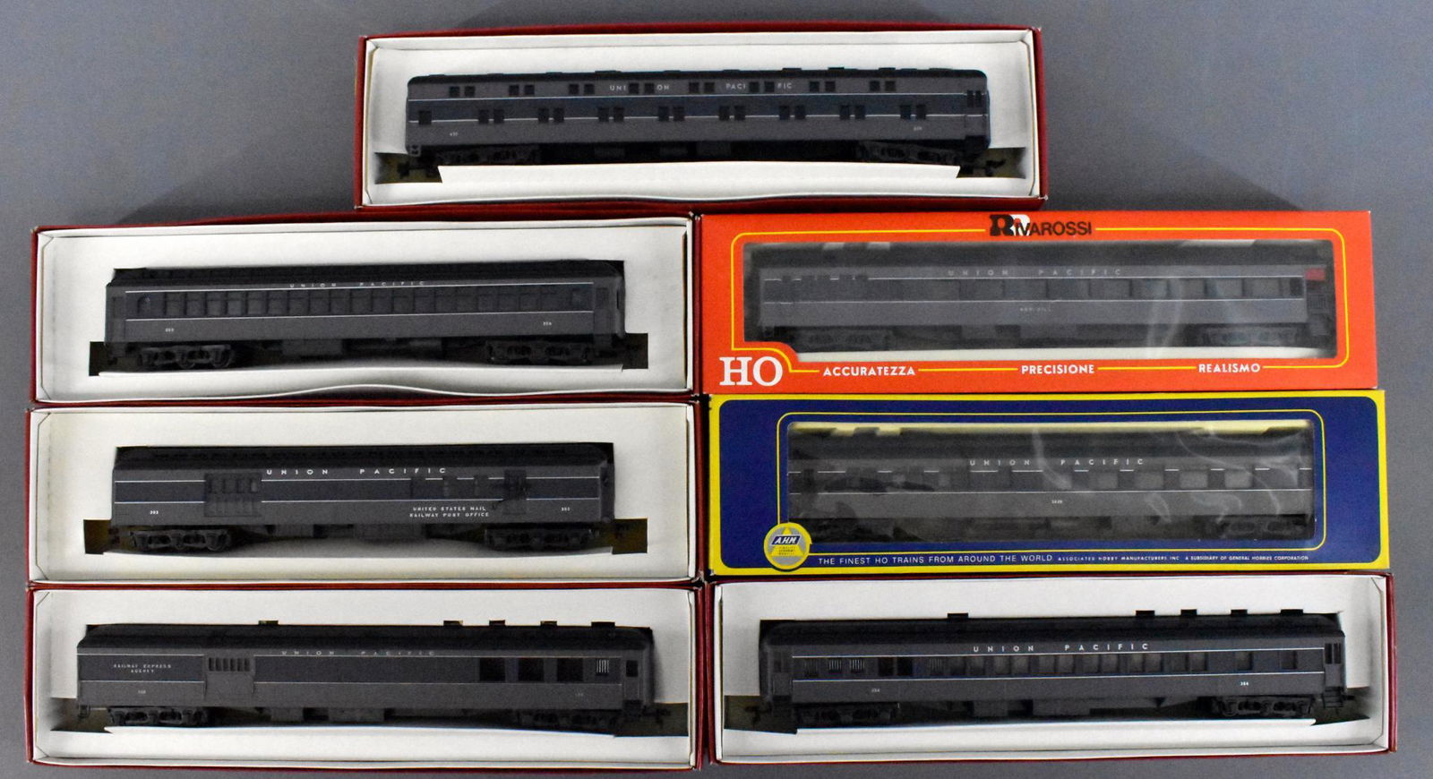Four Rivarossi HO scale Union Pacific heavyweight: Four Rivarossi HO scale Union Pacific heavyweight passenger cars, mint in original boxes. Includes coach, diner, duple sleeper, RPO, combine, Pullman and observation cars, C9-10 in very good to excell