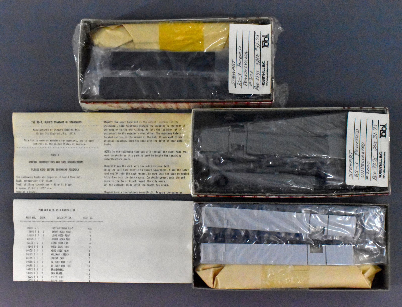 Three Stewart Hobbies HO Alco R-3 powered diesel: Three Stewart Hobbies Alco R-3 powered diesel locomotive kits, mint in original boxes. Includes two stock number 2000 undecorated Phase IIA and one 3100 Pennsylvania Phase II unit. Two are sealed and 