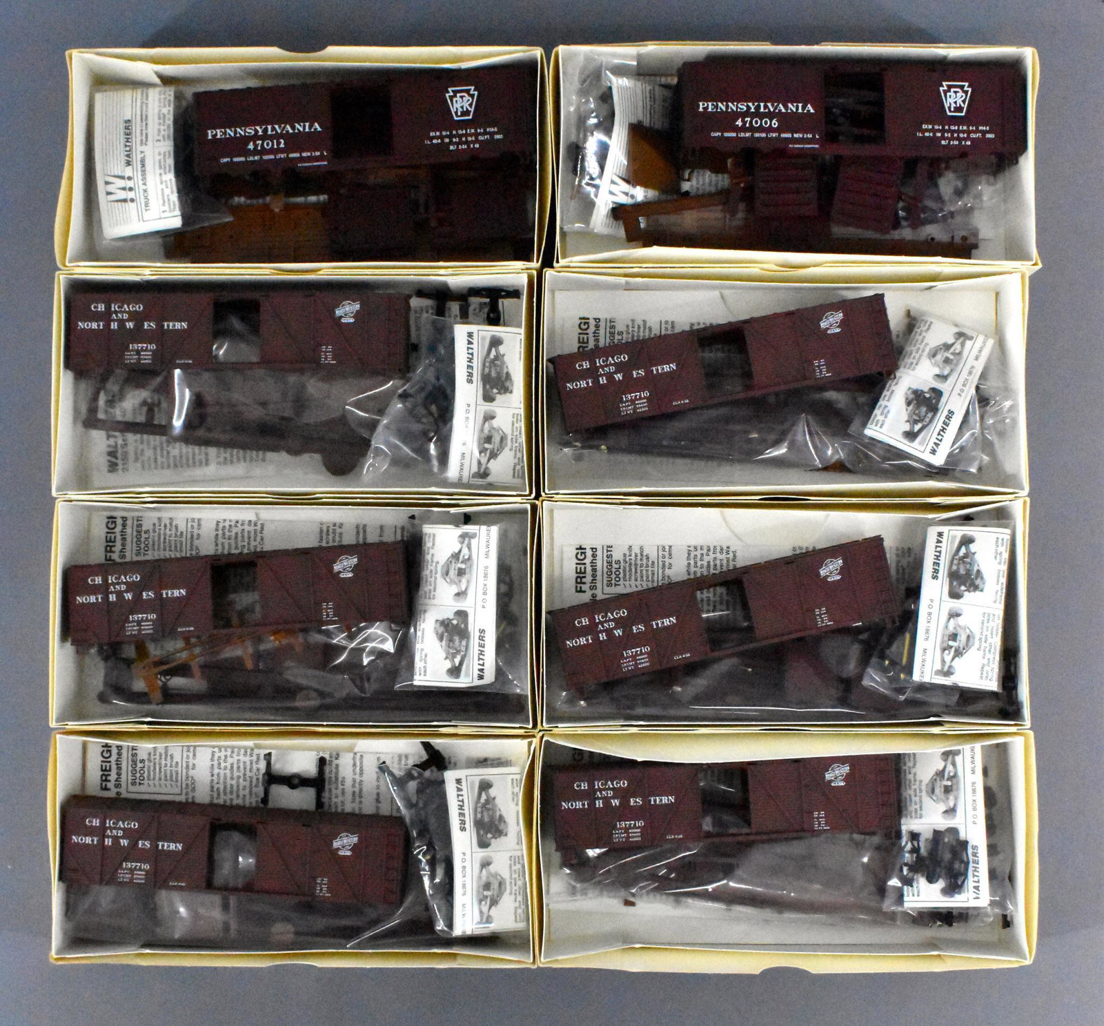 Eight Walthers HO scale box car kits MIB: Eight Walthers HO scale box car kits, mint in original boxes. Includes six 2157 Chicago & Northwestern 40' SS wood box w/ wood ends and two 3717 Pennsylvania 40' PS1 box car kits, all complete with or
