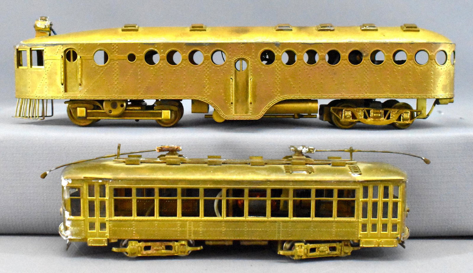 Two vintage HO scale brass traction cars McKeen: Two vintage HO scale brass traction cars to include one McKeen car and one powered traction unit, C5-6.