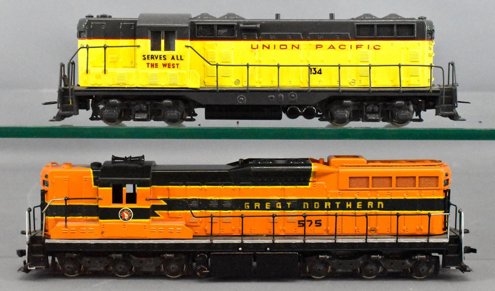 Two Tenshodo HO scale brass diesel locomotives: Two Tenshodo HO scale brass diesel locomotives to include a Great Northern GP-9 with an original box that is not shown and a Union Pacific GP-7, both are C8 but the drive coupling on the GP-7 will nee