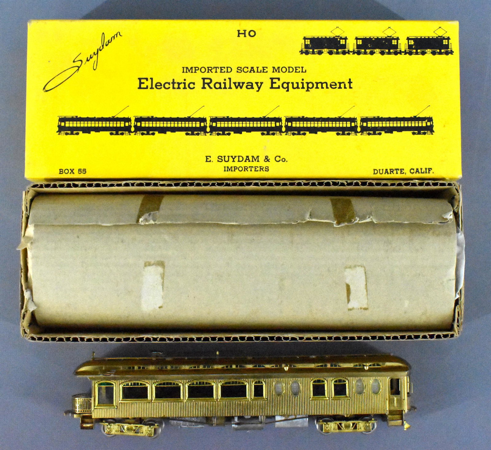 E Suydam HO brass #1001 powered 62' Niles wood: E Suydam HO brass #1001 powered 62' Niles wood interurban observation car in original box. Unit has been fully assembled with detail parts under the frame and all window strips / inserts. Show moderat