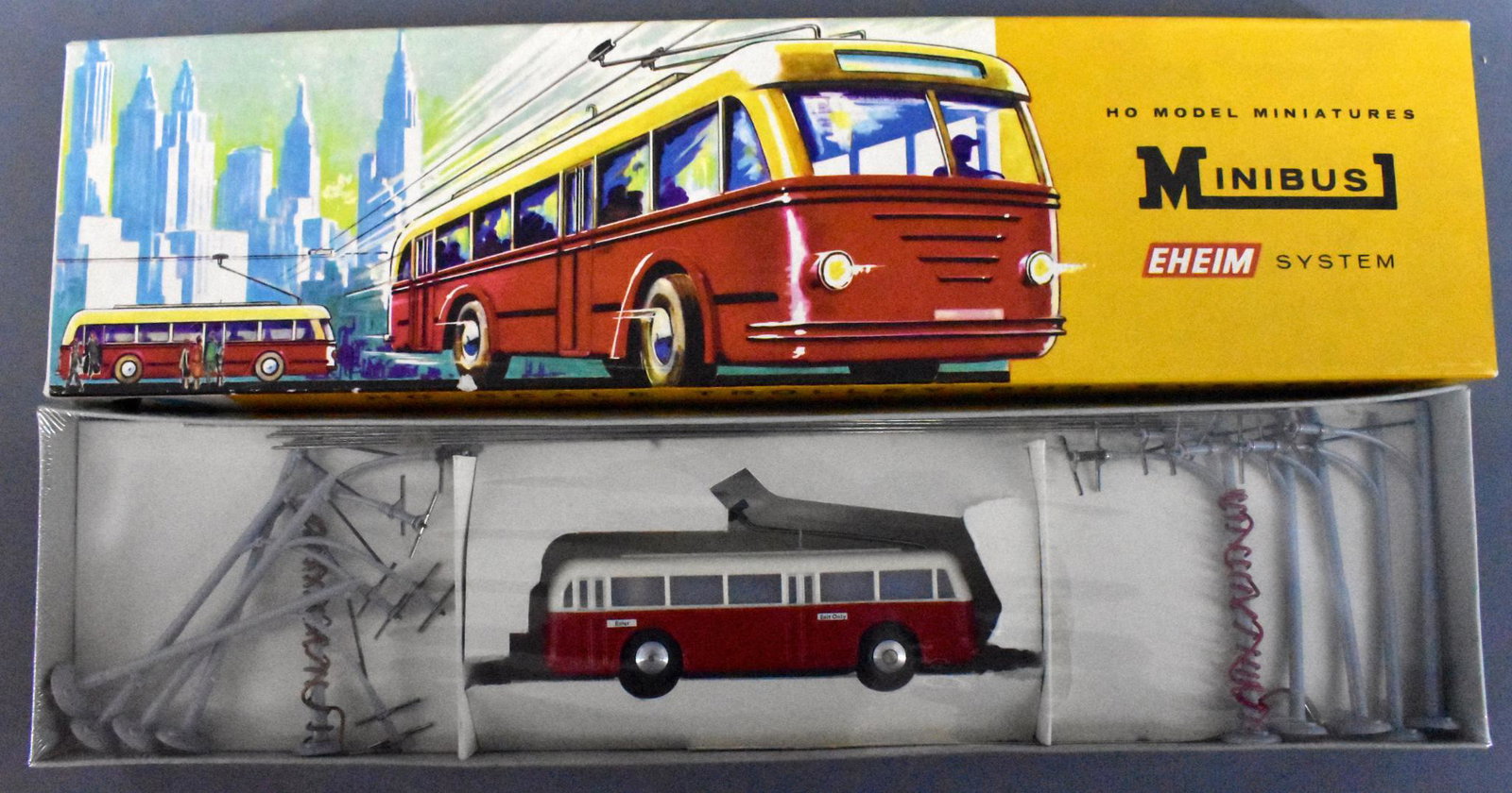 AHM HO Scale Trolley Bus System in OB: AHM HO Scale Trolley Bus System in original box. This is a red bus and all contents are factory shrinkwrapped in an excellent box.