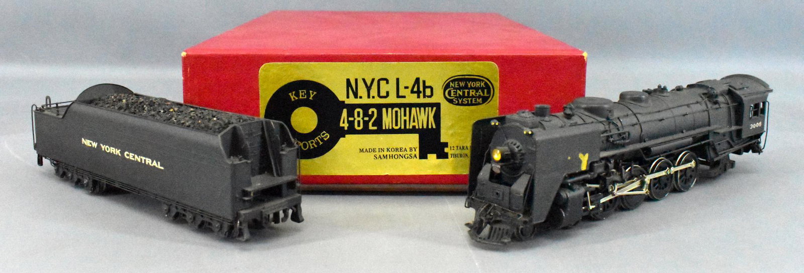 Key Imports HO NYC L-4b 4-8-2 factory painted in OB: Key Imports NYC L-4b 4-8-2 factory painted in original box , very nice painted engine and tender C6-C7 due to a largish chip to the front sheath on the left side facing forward, otherwise very few oth