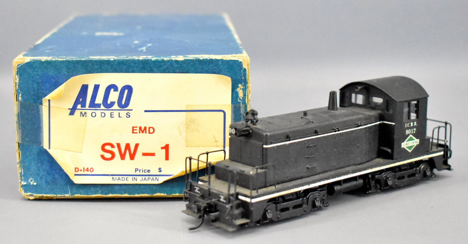 Alco Brass HO EMD SW-1 in OB: Alco Brass HO EMD SW-1 in original box , custom painted, C7-C8 in a fair original box.