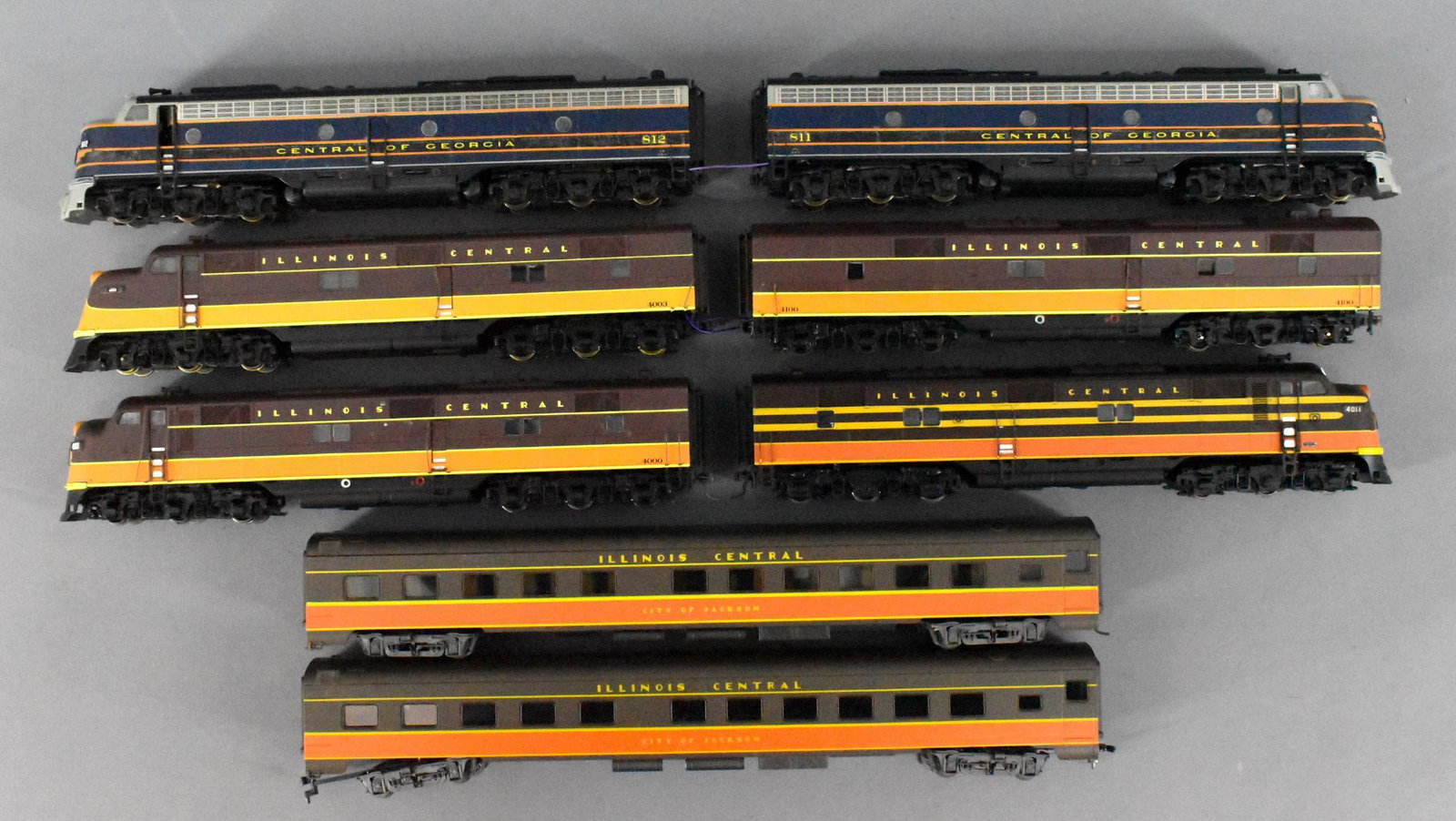 Eight HO Life-Like HO IC Diesels and cars loose: Eight HO Life-Like HO IC Diesels and cars loose. Group includes a wired AB unit, 2 A units, 2 passenger cars, and a Central Georgia wired AA unit.