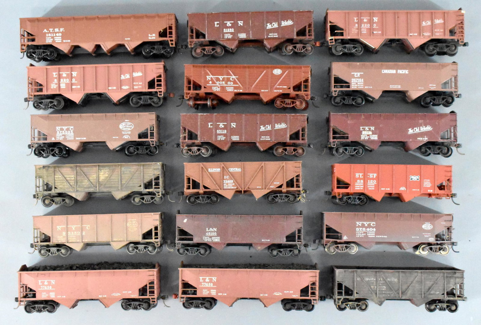 Eighteen HO mixed brand 2-Bay Hoppers loose: Group includes mixed lot of road names including NYC, L&N, ATSF, and IC, all are used in good or better condition. All are sold as is, as seen, with no returns.