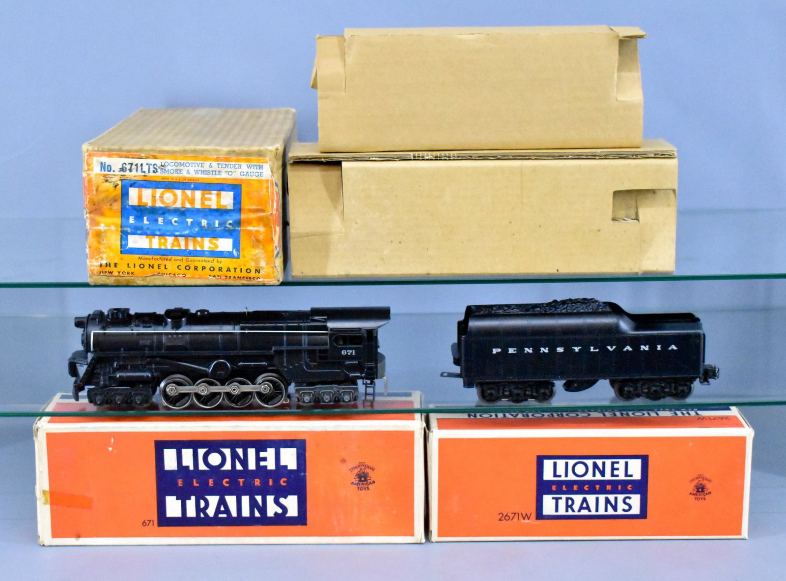 Lionel postwar O Gorgeous 671LTS in master carton: Lionel postwar O Gorgeous 671LTS in master carton. Locomotive shows very light run time and is C8+, tender shows light run time and is C8. Both have extremely nice silver lettering. The master carton 