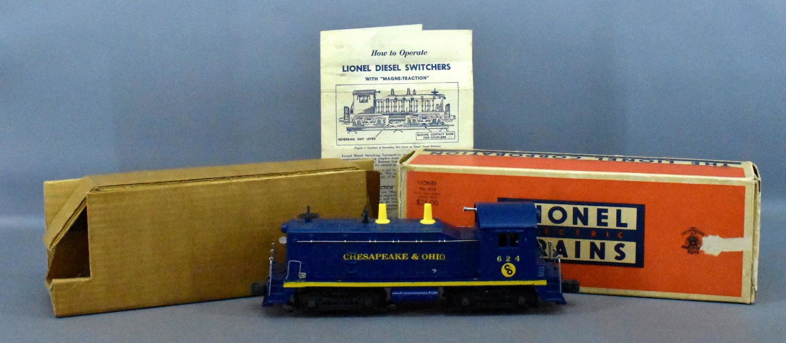 Lionel postwar O 624 C&O diesel switcher in original: Lionel postwar O 624 C&O diesel switcher in original box. Unit shows moderate run time and is exceptionally clean, ten stanchion variation. Fantastic lettering and decals on both sides, C7. Includes a