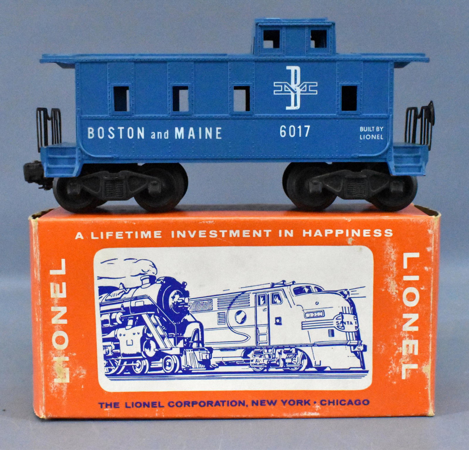 Lionel postwar O 6017-100 Boston & Maine caboose in: Lionel postwar O 6017-100 Boston & Maine caboose in original box. Car shows light run time and is C8 with a very good original box that is missing one inner flap.