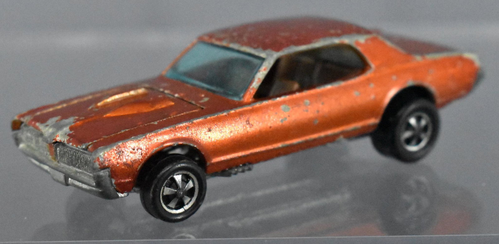 Redline Hot Wheels orange painted tooth custom Cougar: Redline Hot Wheels orange painted tooth custom Cougar w/ bubble gum wheels. Sold as-is as seen in the photos with no returns.