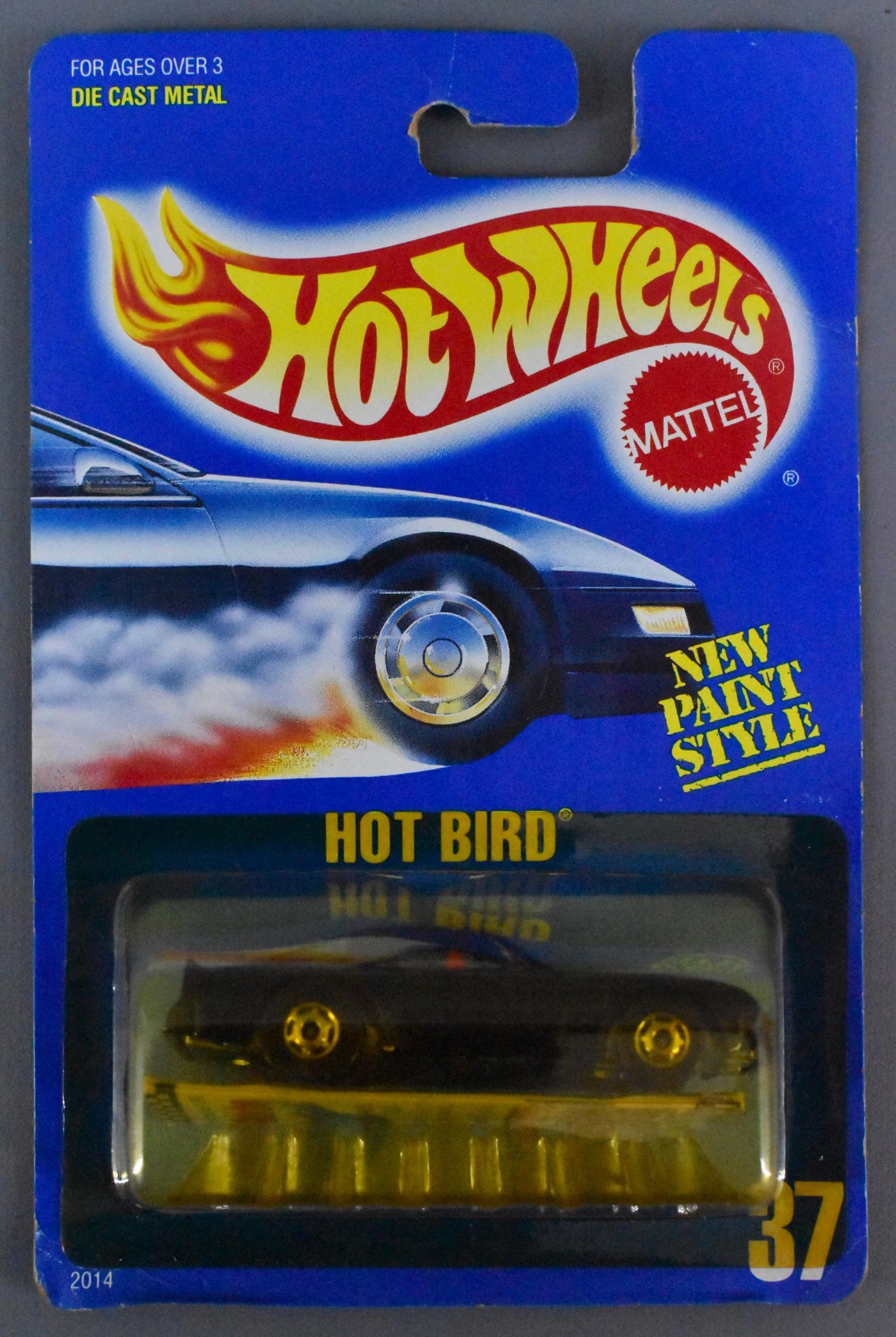 Hot Wheels blue card 37 Hot Bird MOC Gold Hot Ones and: Hot Wheels blue card 37 Hot Bird, mint on a sealed blister card with Gold Hot Ones wheels and a red interior. Card is good with some creases and the blister is yellowed or smoke color.
