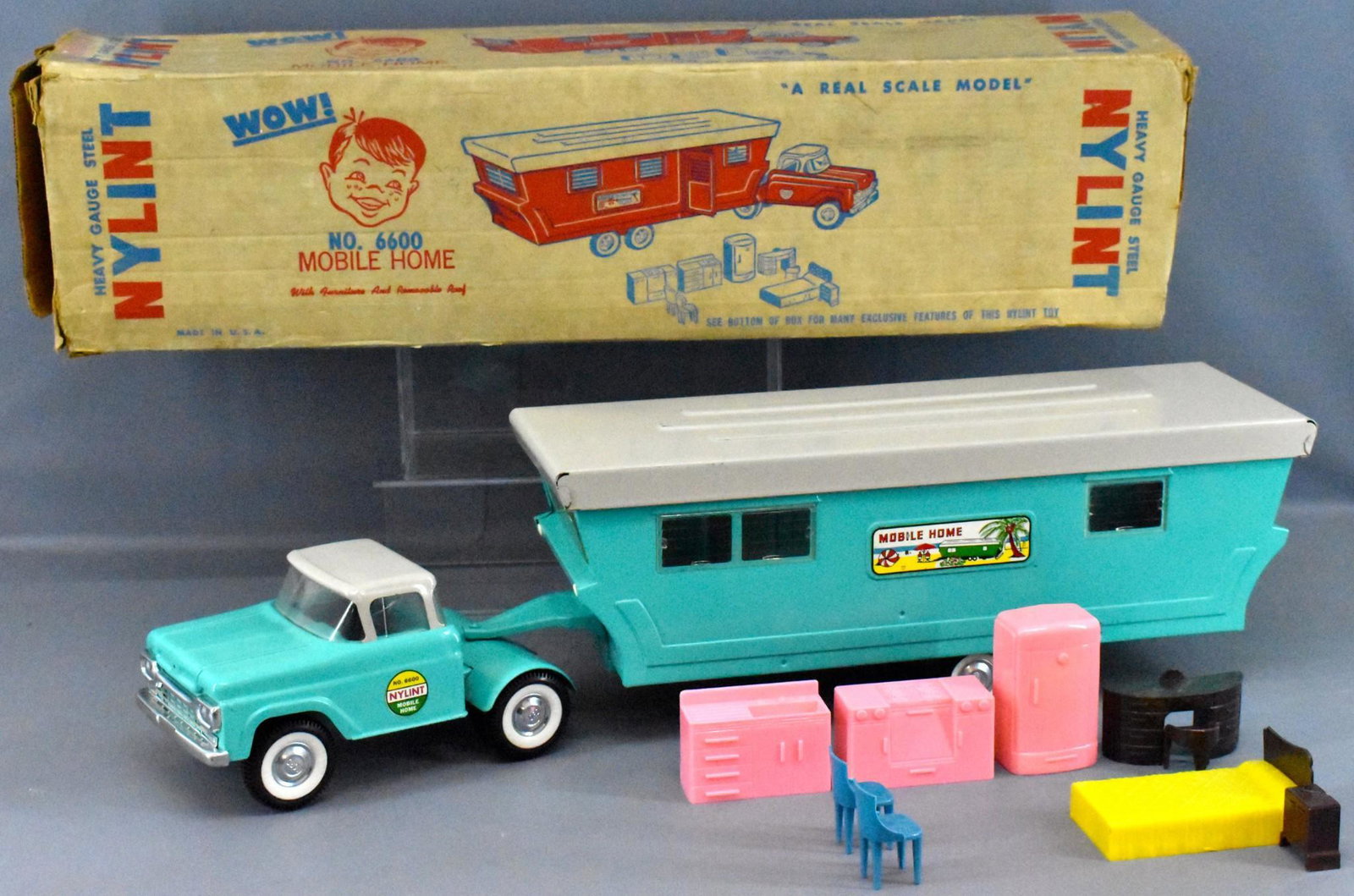 Fantastic Nylint pressed steel Mobile Home in original: Fantastic Nylint pressed steel Mobile Home in original box, complete with original Plasco furniture. Super condition with a small rub on the roof and a few tiny scratches, the worst of it is a small c