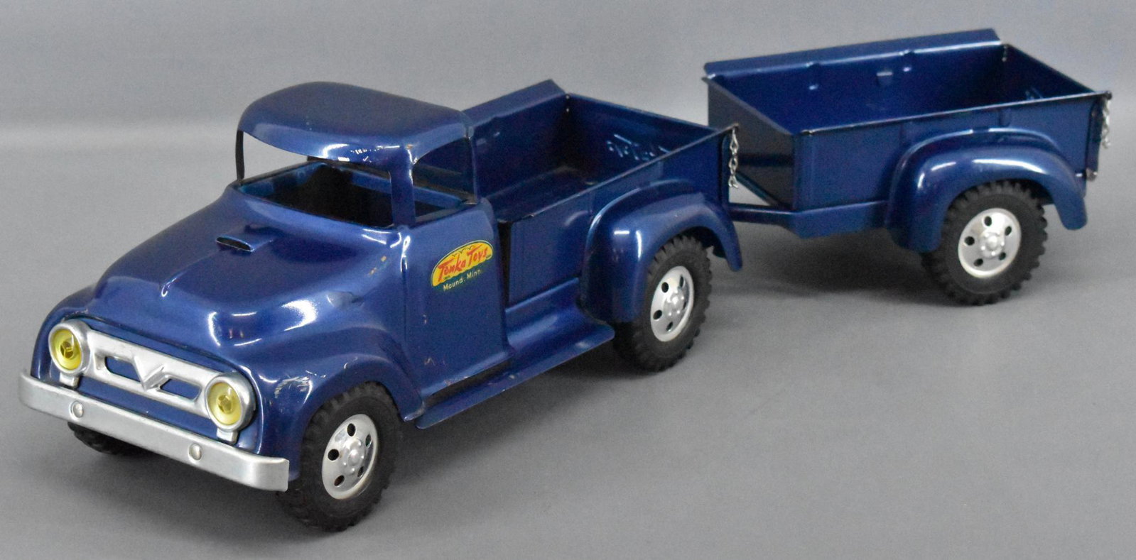 Original 1957 Tonka pressed steel pickup truck and: Original 1957 Tonka pickup truck and trailer in super condition but has a small ding in the left front fender. There is some paint crazing inside the trailer bed as well but displays very nicely as se