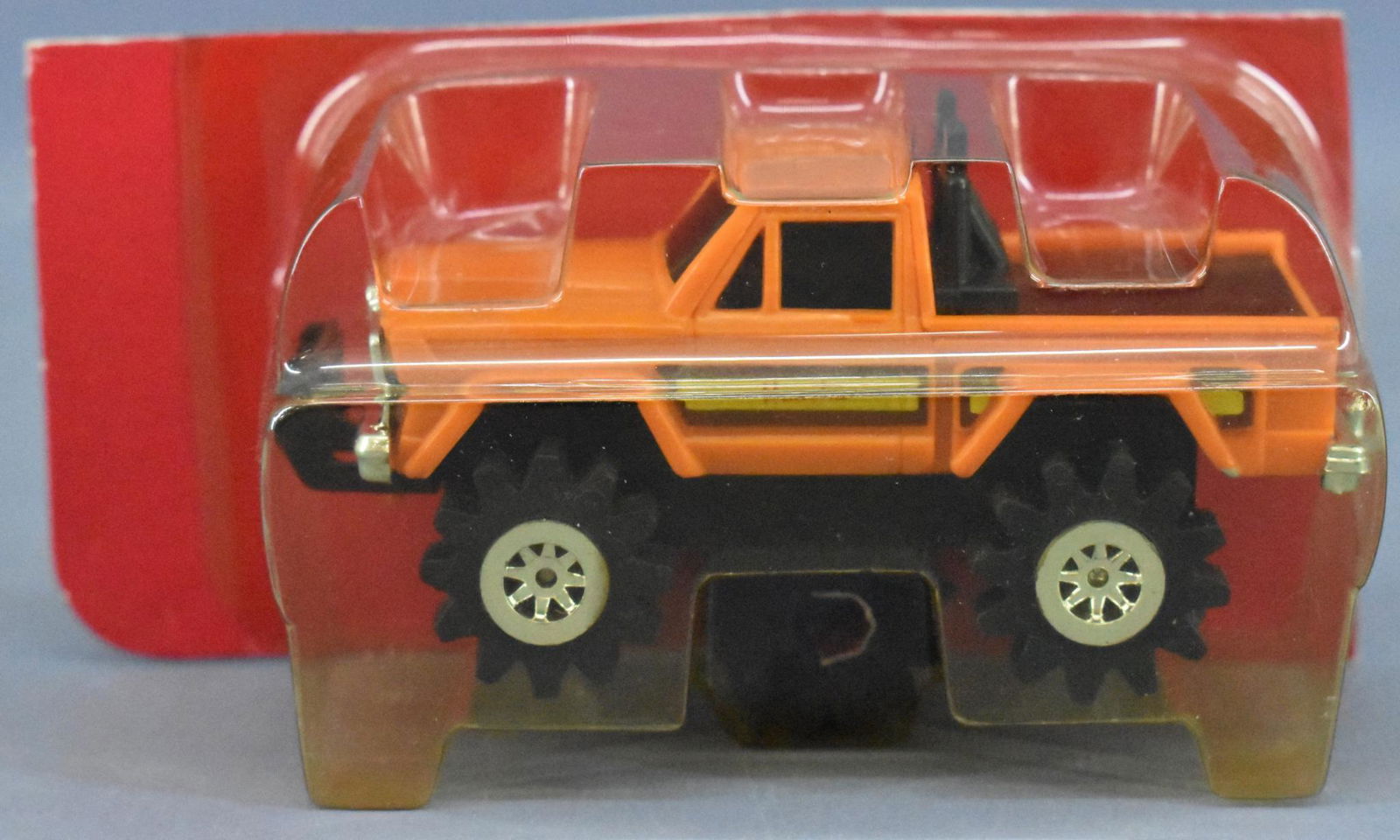 Mint 1980's Schaper Stomper Jeep Honcho on cut blister: Mint 1980's Schaper Stomper Jeep Honcho on cut blister card, orange with brown and yellow stripes. Mint truck on a cut card with a nice, clear blister and four spare foam tires.
