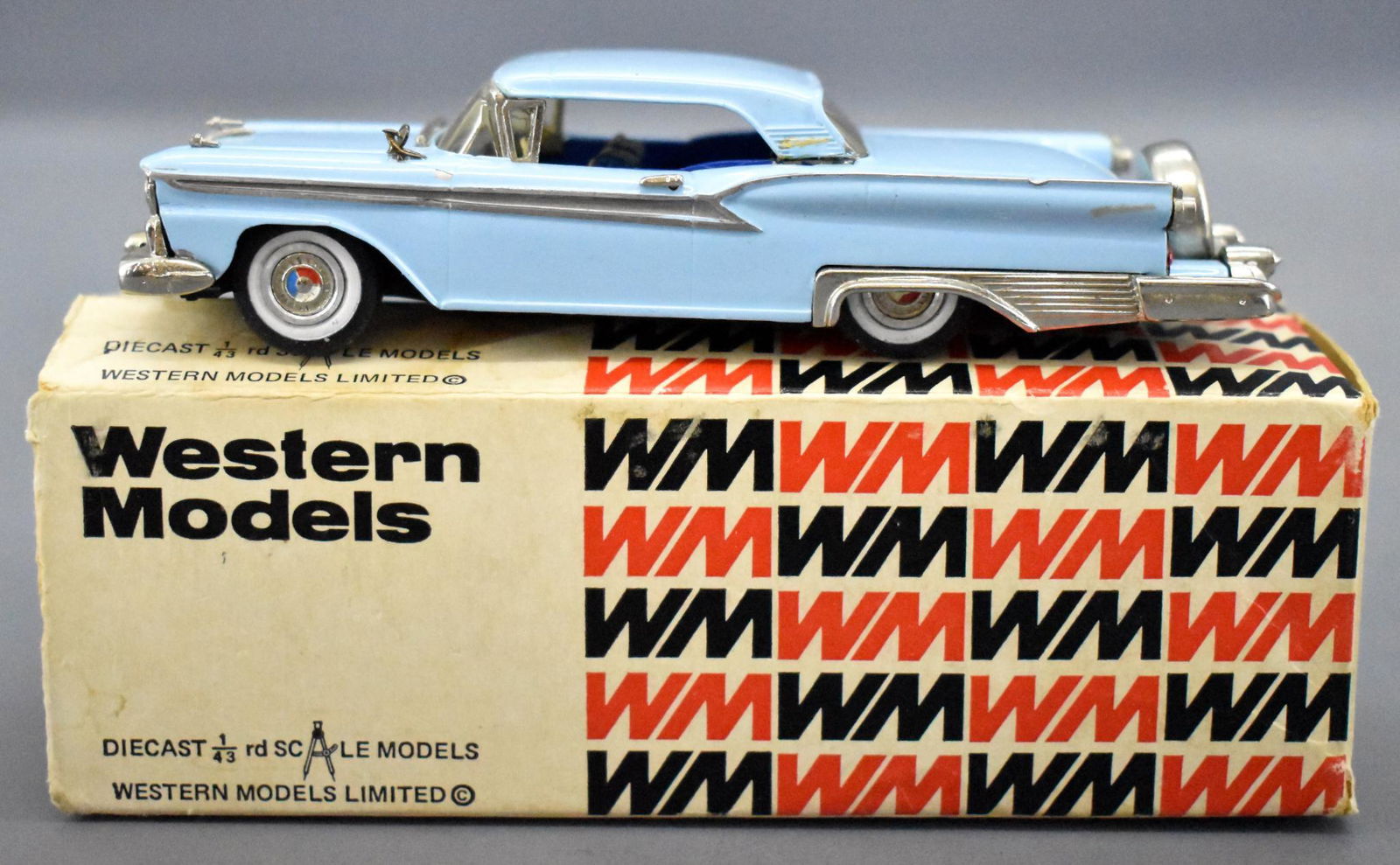 Western Models WMS 46 1959 Ford Galaxie Skyliner 1/43: Western Models WILLIAMS 46 1959 Ford Galaxie Skyliner 1/43 die cast in original box, very nice condition but missing one fender ornament and with some minor paint loss from the chassis. The box is mis