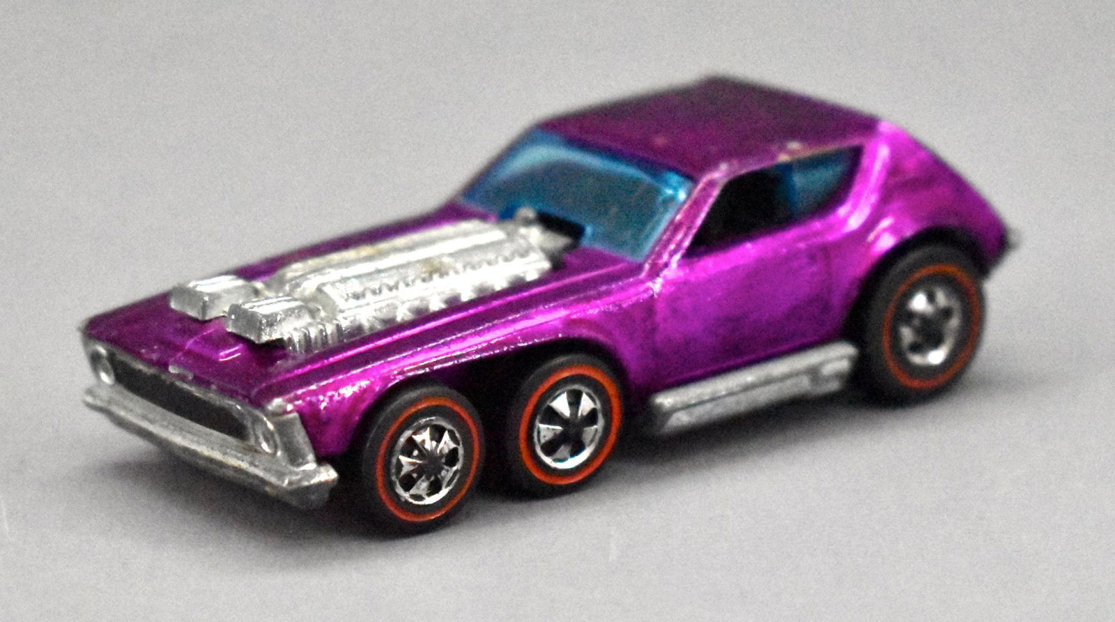 Redline Hot Wheels MAGENTA HK Open Fire: Redline Hot Wheels MAGENTA HK Open Fire, generally very nice but has a bad spot on one side above the fender as seen in the photos .