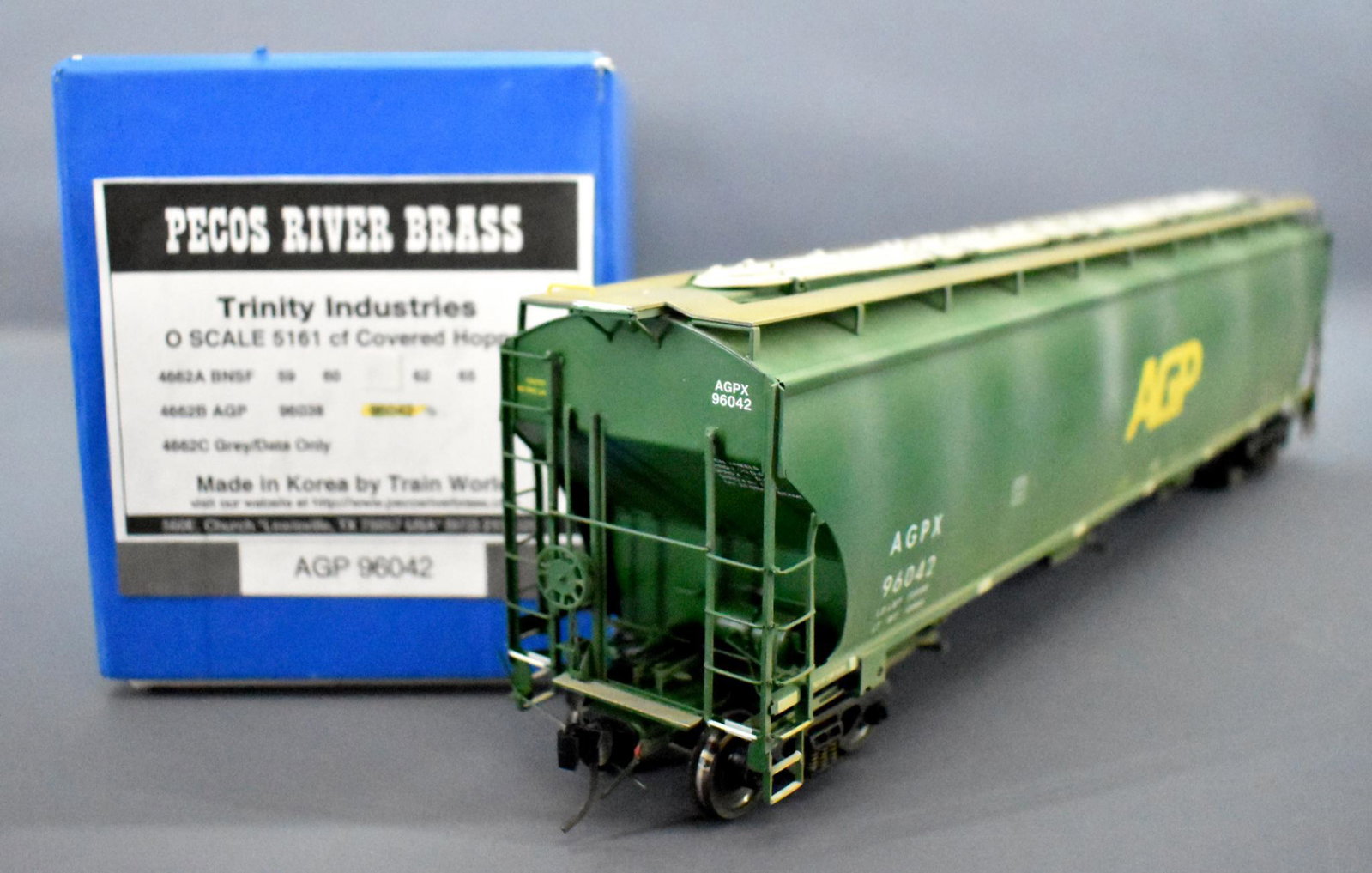 Pecos River O scale brass AGP 3 bay covered hopper in: Pecos River O scale brass AGP 3 bay covered hopper in original box. Car is slightly weathered and shows light run time but is C7-8 in an excellent original box with original foam insert.