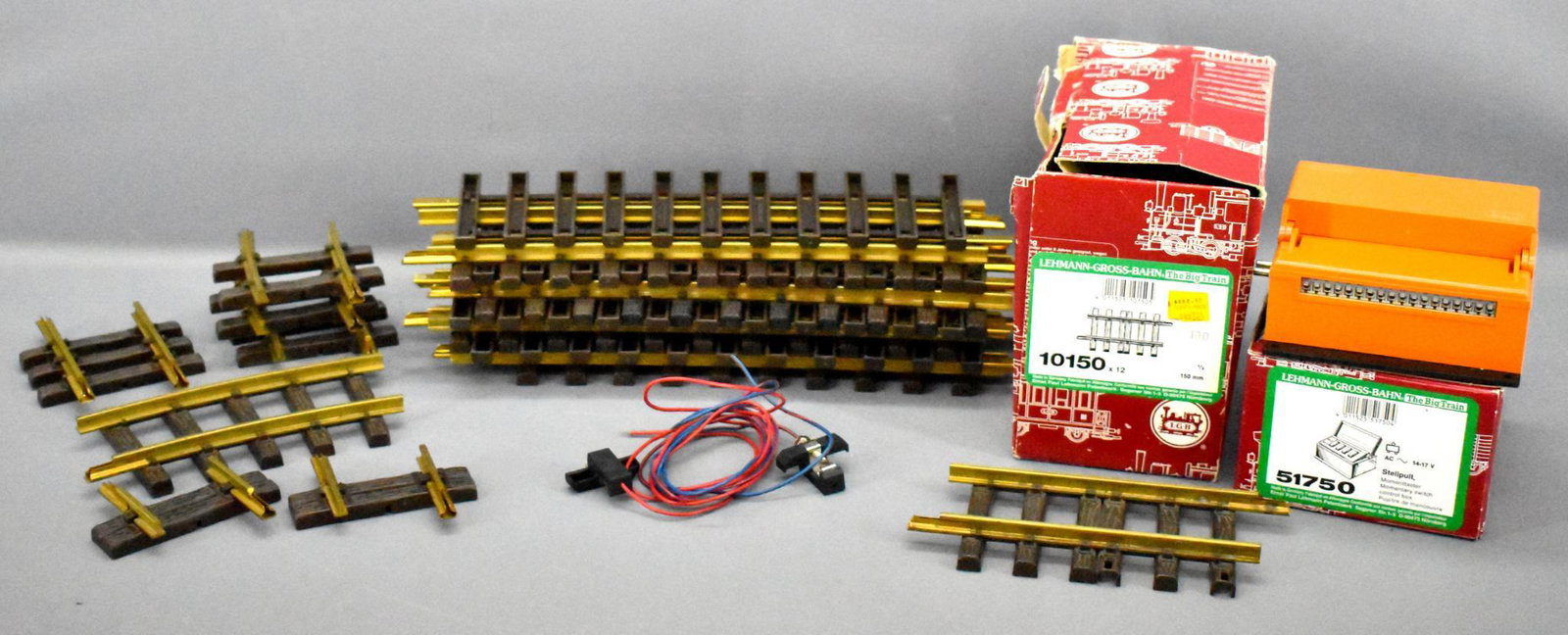 Group of mixed LGB G scale track pieces: Group of mixed LGB G scale track pieces. Includes eight 10150, eight 18000 15 degree curve, three 1104 curve, two 1004 straight, one 1007 straight, one 1102 curve, one 51750 switch controller and a se