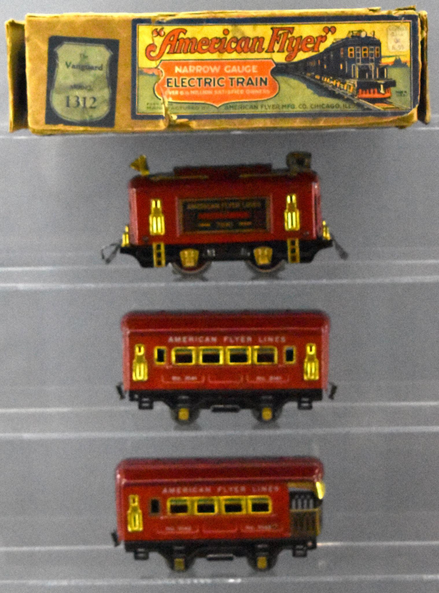American Flyer Prewar narrow gauge O 1312 The Vanguard: American Flyer Prewar narrow gauge O 1312 The Vanguard passenger train set in original box. Set consists of 3100 electric locomotive, 3141 coach and 3142 observation cars plus eight curved track, C6-7