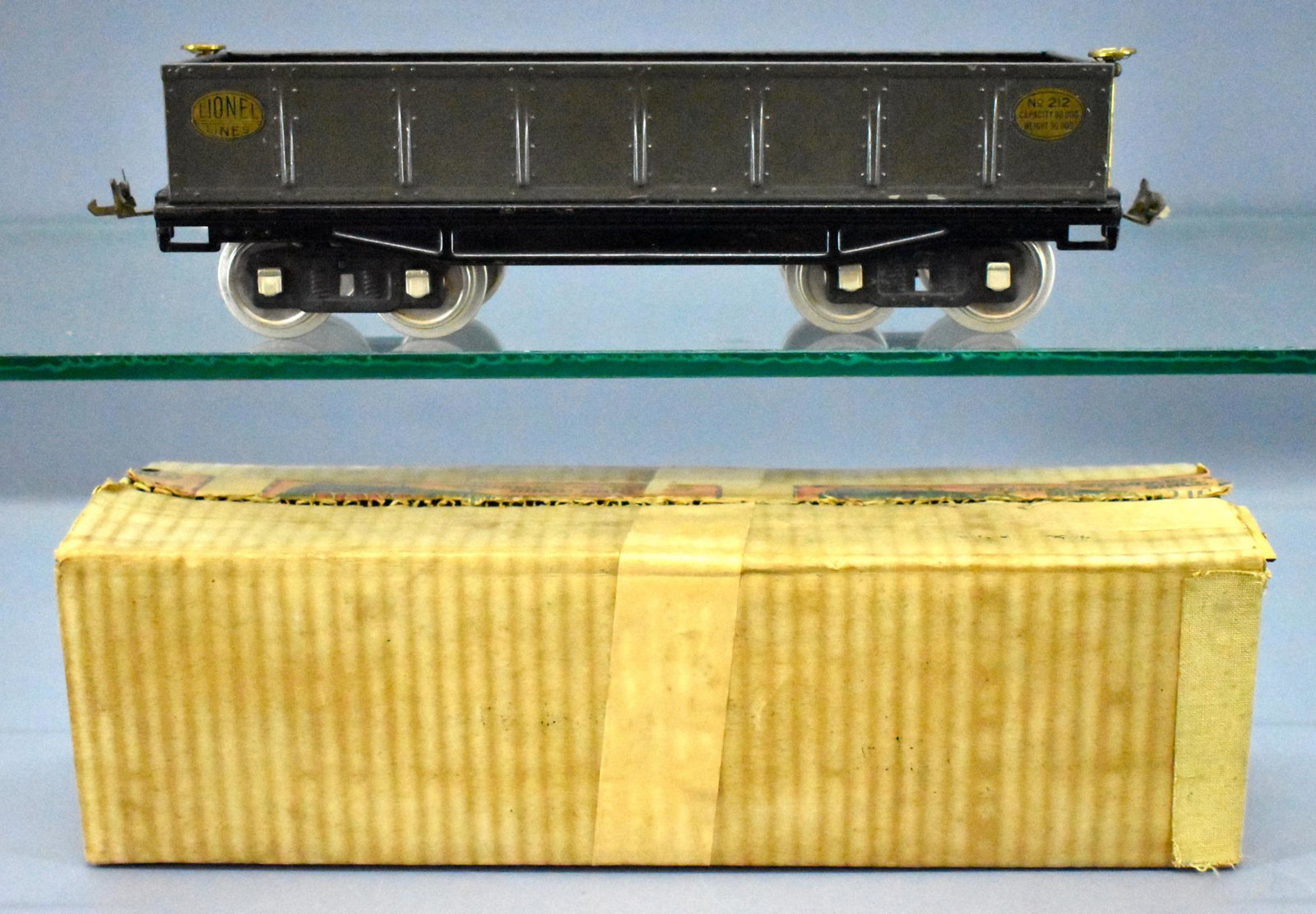 Lionel prewar standard gauge 212 GRAY gondola in: Lionel prewar standard gauge 212 gray gondola with brass and nickel trim, C6 with an excellent original box.