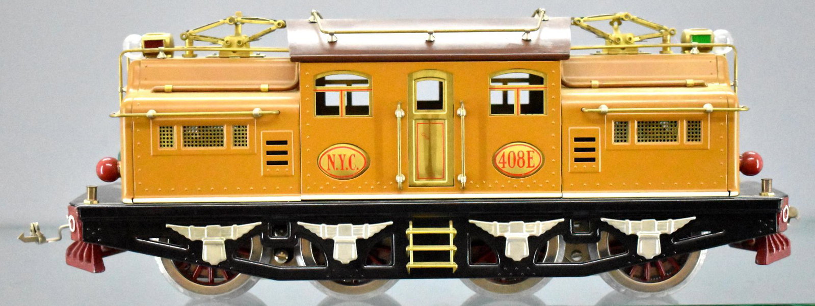 Lionel Classics standard gauge 408E two tone brown: Lionel Classics standard gauge 408E two tone brown electric locomotive. Unit shows little to no run time but has been displayed and is missing one flag stanchion from one end which leaves the pilot lo