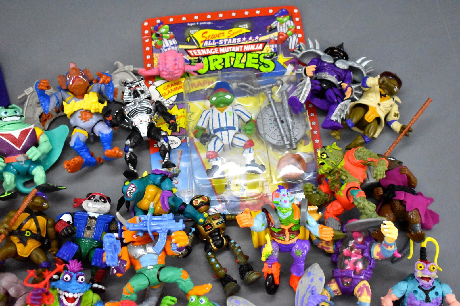 Large group of early 1990's TMNT Teenage Mutant Ninja: Large group of early 1990's TMNT Teenage Mutant Ninja Turtles action figures, many figures and many weapons, lot of pieces still on sprues. Lots of stuff, all previously played with but overall in ver