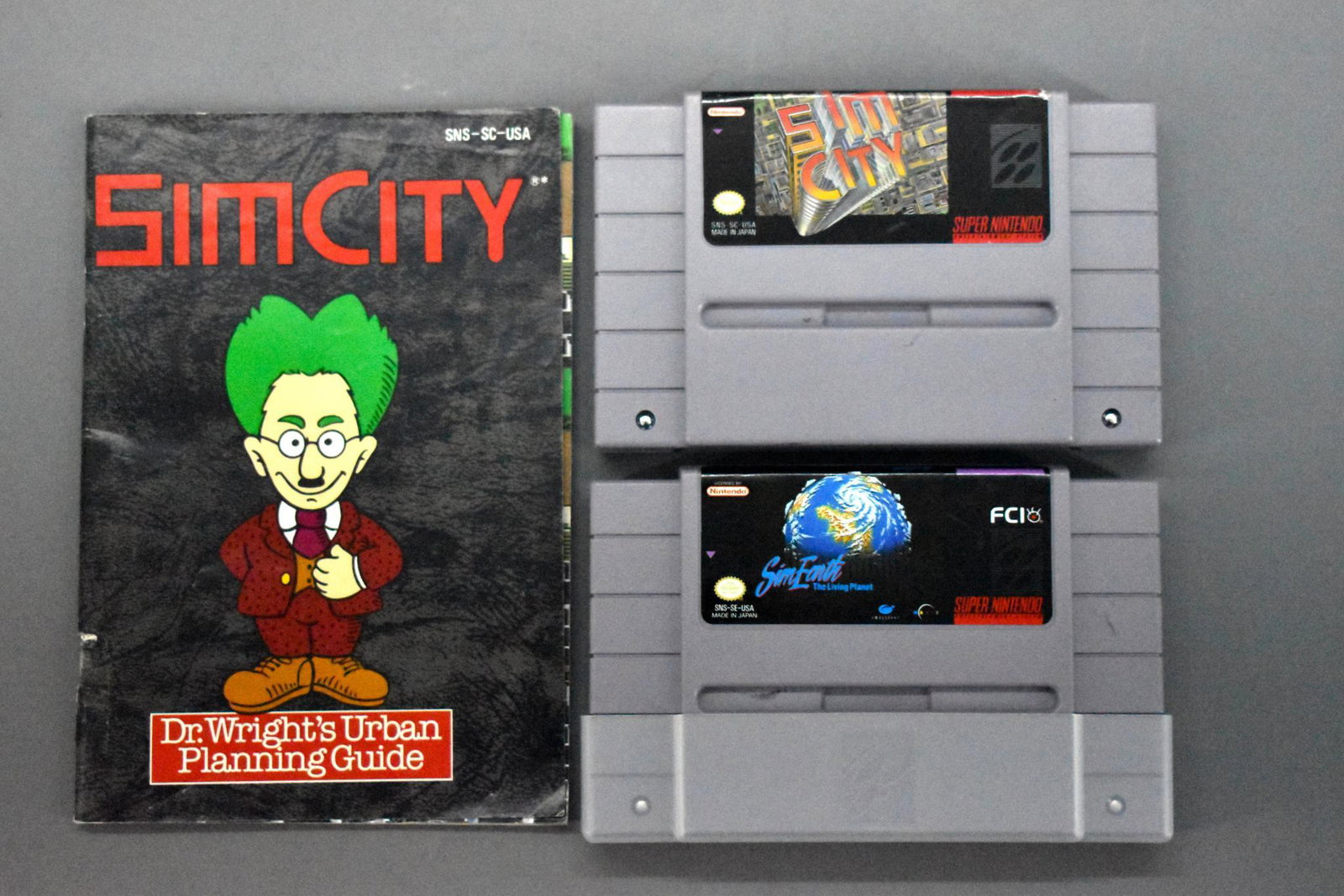SNES Super Nintendo Sim City cartridge with manual plus: SNES Super Nintendo Sim City cartridge with manual plus Sim Earth. Cartridges are very good to excellent with a very good Sim City manual. Game is untested.