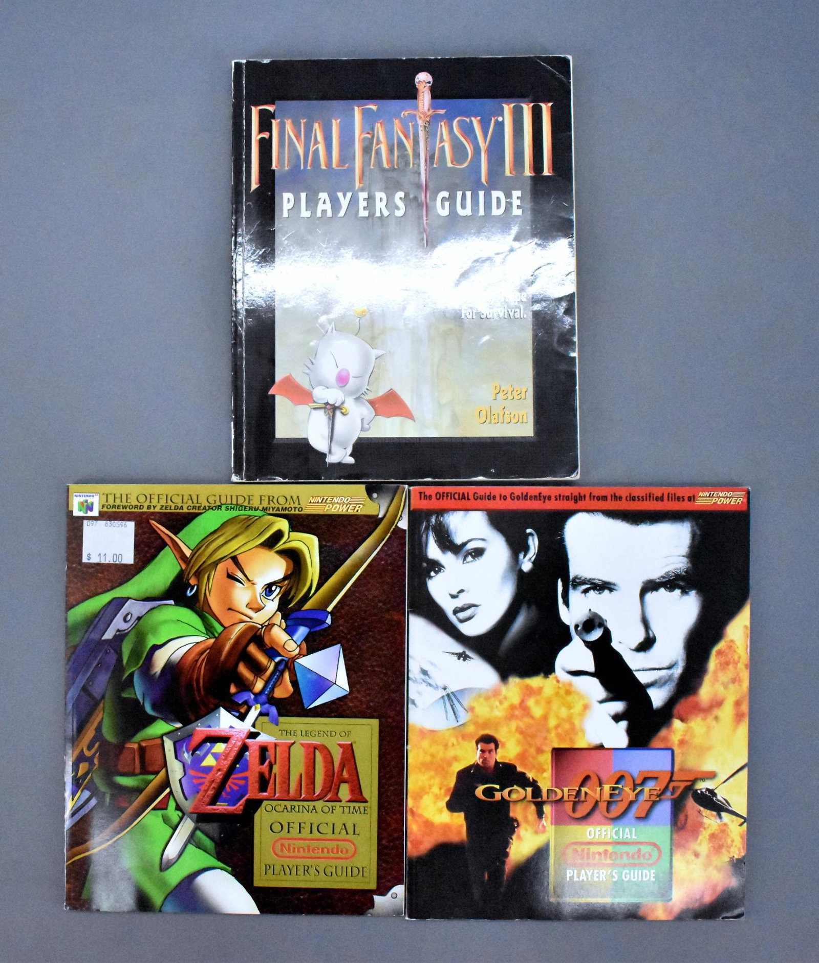 Three Nintendo Player's Guides Final Fantasy III: Three Nintendo Player's Guides to include Final Fantasy III, Goldeneye and The Legend of Zelda : Ocarina of Time, all in good to very good condition.