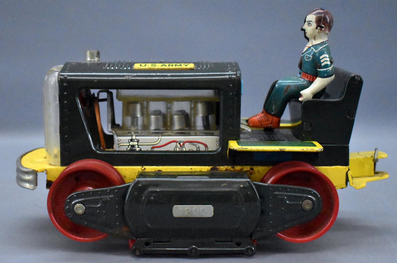 Linemar battery operated US Army tractor for parts: Linemar battery operated US Army tractor for parts, has corrosion inside both battery boxes, a cracked clear grille piece and is missing both tracks. Sold as-is as seen in the photos with no returns.