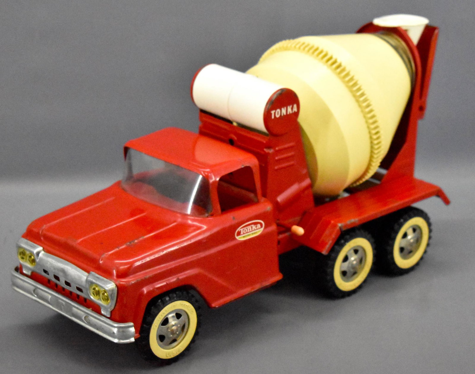 1961 Tonka pressed steel cement mixer truck: 1961 Tonka pressed steel cement mixer truck, complete but with paint wear as seen in the photos. Has 1962 decal on the sides as seen in the photos.