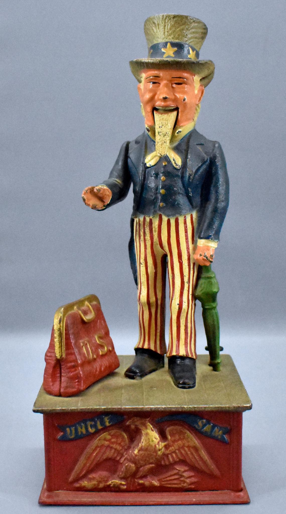 Heavy Cast Iron Reproduction Uncle Sam Mech Bank: Heavy Cast Iron Reproduction Uncle Sam Mech Bank. This bank is solid, heavy and works.