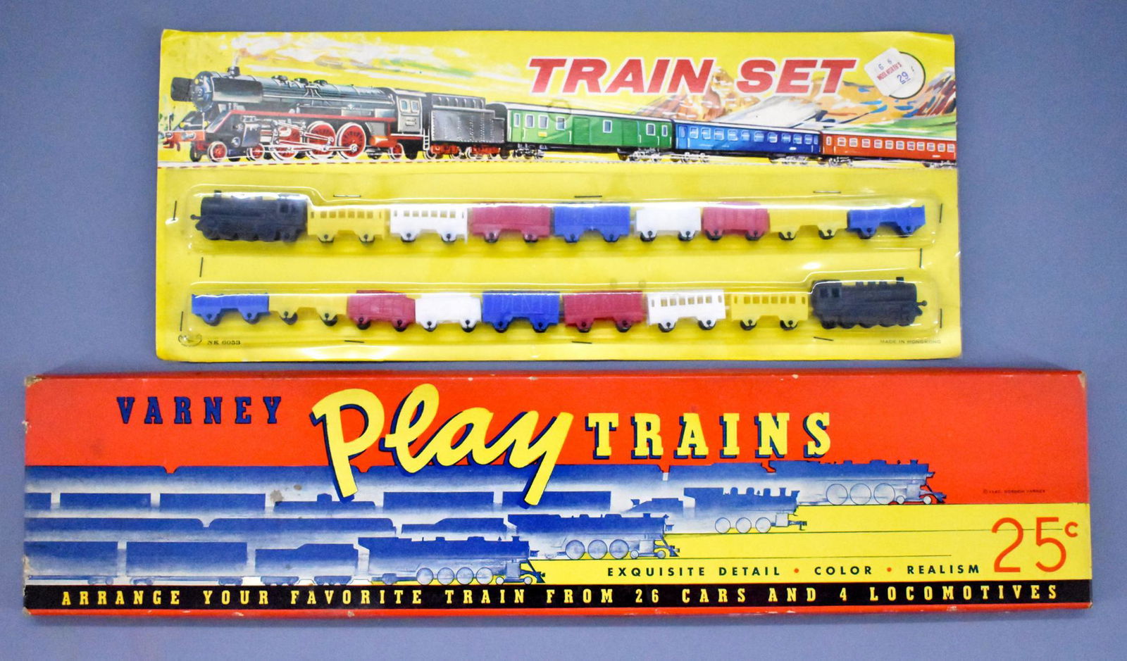 Unused plastic and carboard trains in original boxes: Unused plastic and carboard trains in original boxes to include plastic trains made in Hong Kong plus a mint set of 1940 Varney play trains, unpunched and in a very good original box.