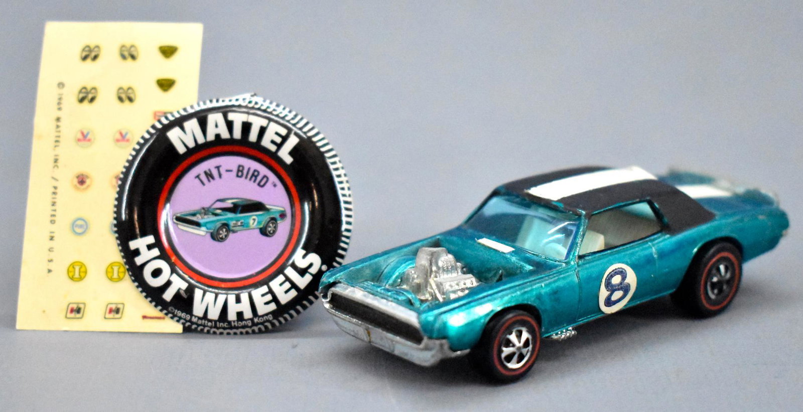 Redline Hot Wheels aqua HK TNT Bird with original: Redline Hot Wheels aqua HK TNT Bird with original button and decal sheet, has some edge wear on the roof and HK pops with a shiny base.
