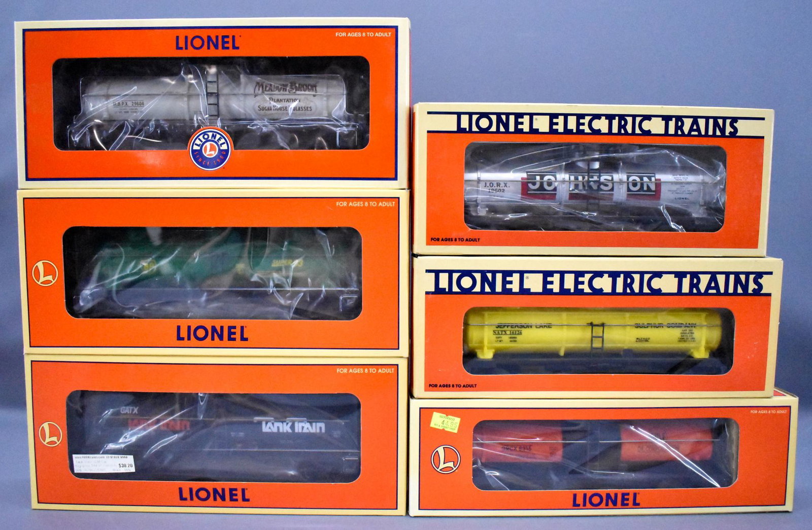 Six Lionel modern era O tank cars in original boxes: Six Lionel modern era O tank cars in original boxes to include 26013 TC SDM tank train, 26107 BP, 19611 6315 Gulf, 19602 Johnson, 16126 Jefferson lake Sulfur Co and 29604 Meadow Brook Molasses, C8 in 