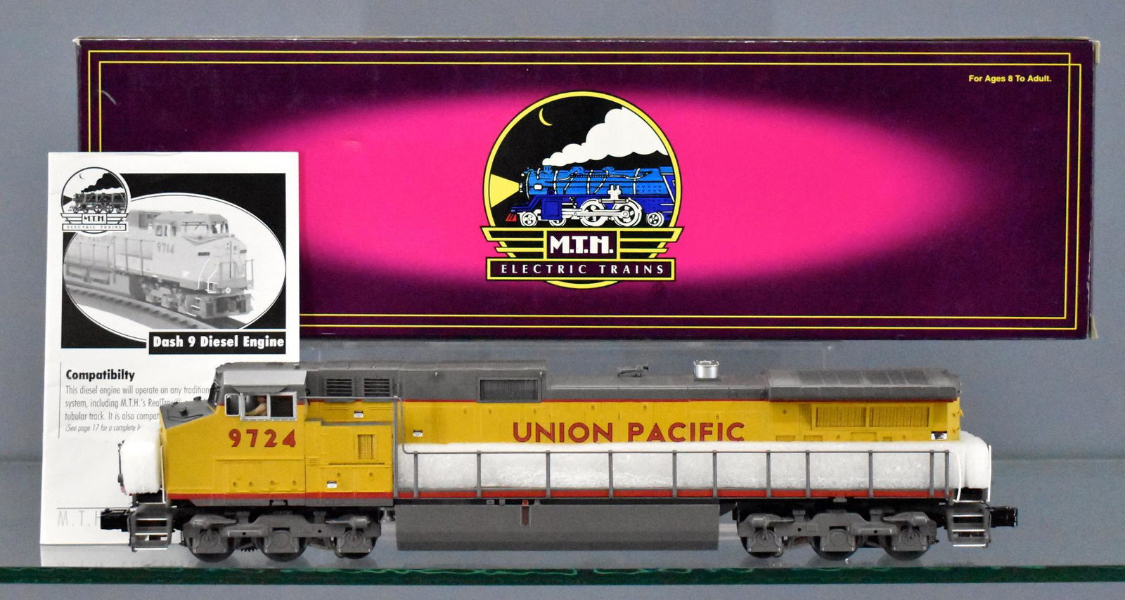 MTH Premier O 20-2558-1 Union Pacific Dash-9 diesel: MTH Premier 20-2558-1 Union Pacific Dash-9 diesel locomotive in original box. Unit shows moderate run time and is C8 in an excellent original box with original paperwork.