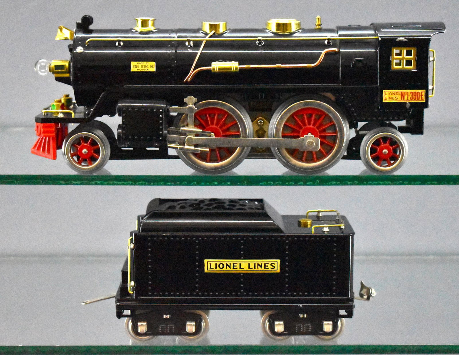 Lionel Classics MTH standard gauge 390E steam: Lionel Classics MTH standard gauge 390E steam locomotive and tender. Locomotive is marked LTI and is C6 with scratches all around the stanchions, tender is marked MTH and is C7-8. There are no boxes w