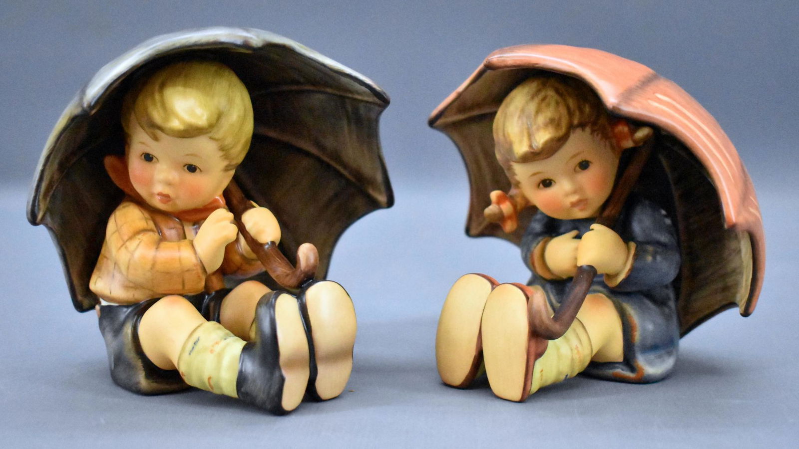 Goebel Hummel 152 /A /B Umbrella Boy and Girl figurines: Goebel Hummel 152 /A /B Umbrella Boy and Girl figurines 1996, both are mint but have no original boxes or paper.