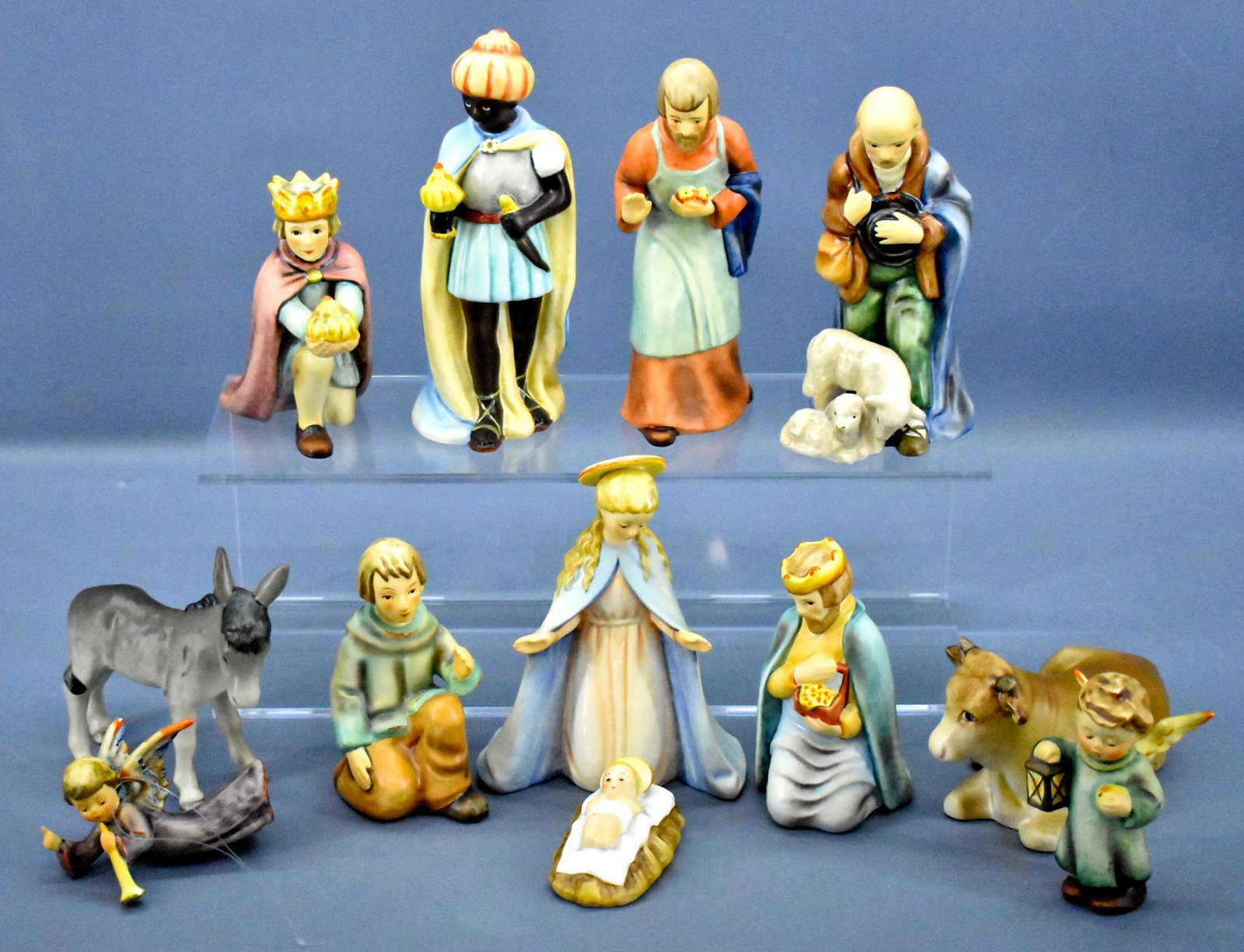Twelve 1980's Hummel 214 Nativity scene figurines: Twelve 1980's Hummel 214 nativity scene figurines, all but the trumpeting angel are in excellent to near mint condition but have no boxes for any of them. The Joseph figure is just under 6" tall. The