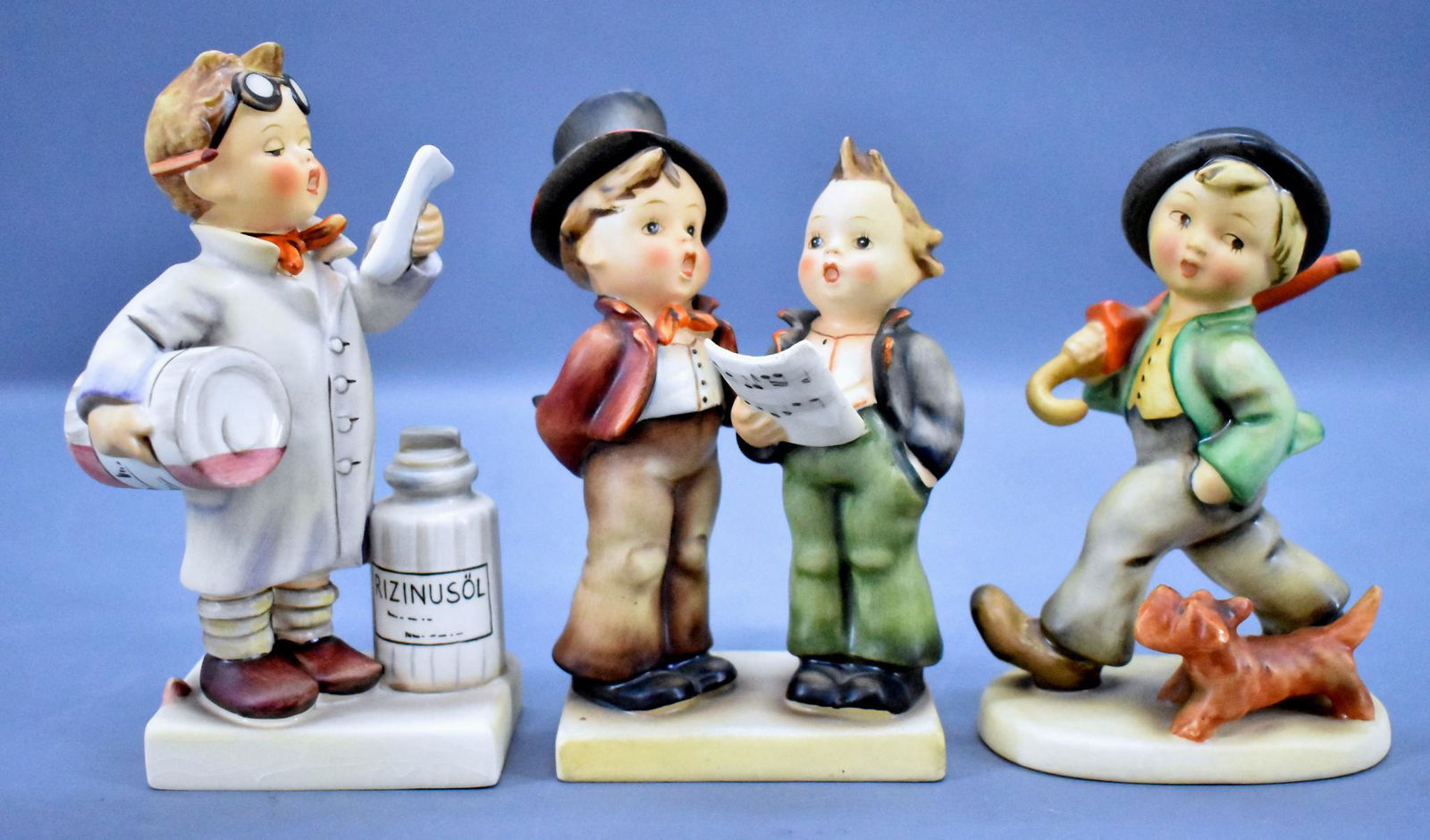 Goebel Hummel 5 130 and 322 figurines: Goebel Hummel 5 Strolling Along TMK 2, 130 Duet TMK 2 and 322 Little Pharmacist TMK 5, all three are in near mint condition but have no boxes.
