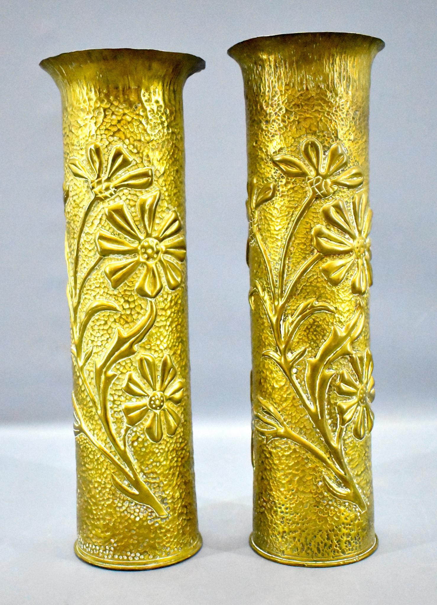Pair of large WWI WWII trench art 75mm artillery shell: Pair of large WWI WWII trench art shell casing vases, unsure as to when they may have been made but the bottom of the shells have DEC 75 on them along with some other numbers, etc. They stand 12 1/2"
