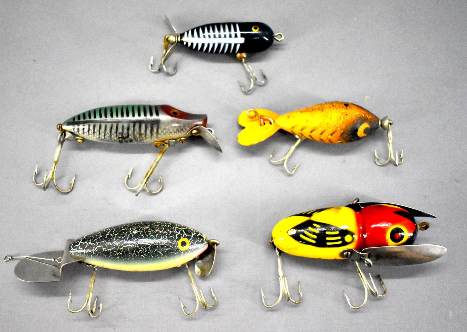 Group of vintage Heddon fishing lures: Group of vintage Heddon fishing lures. includes Crazy Crawler 2100 YRH with 2 piece hardware, Go-Deeper Crab, plastic Tiny Torpedo, plastic River Runt spook floater and a Whopper Stopper plug. Various